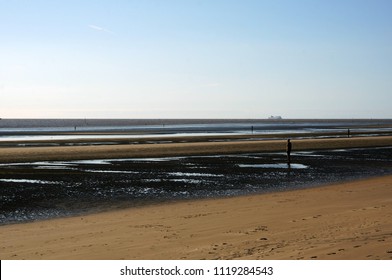 Another Place, A Piece Of Modern Sculpture By Sir Antony Gormley Located At Crosby Beach
Liverpool City Region, England, United Kingdom          