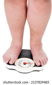 Another pound. A closeup shot of an overweight man weighing himself on a scale.