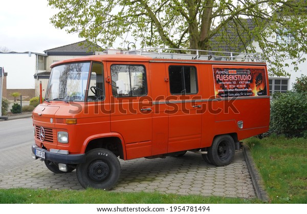 Anrath,Germany-April 12,2021: The old timer Orange\
Mercedes-Benz mini bus model LF 608 D29 , built in 1975  parks in\
Anrath. 