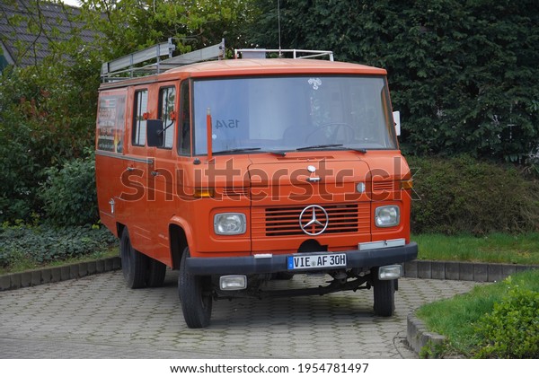 Anrath,Germany-April 12,2021: The old timer Orange\
Mercedes-Benz mini bus model LF 608 D29 , built in 1975  parks in\
Anrath. 