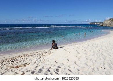 ANSE BERTRAND, GUADALUPA - MARCH 2018: People Taking A Bath In The Carribean Sea Water Of Anse Bertrand In The North Of Guadeloupe Island