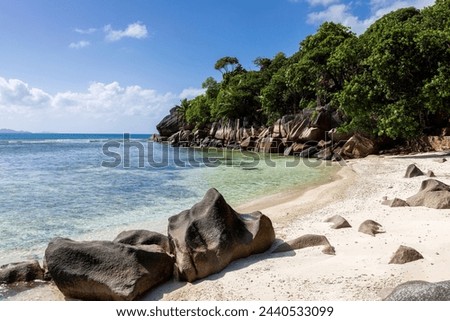 Anse Source d'Argent - granite rocks at beautiful beach on tropical island La Digue in Seychelles