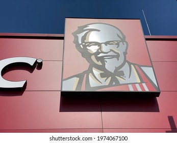 Ansfelden, Austria - May 1 2021: The Colonel Sanders Icon on a Kentucky Fried Chicken (KFC) restaurant near Linz