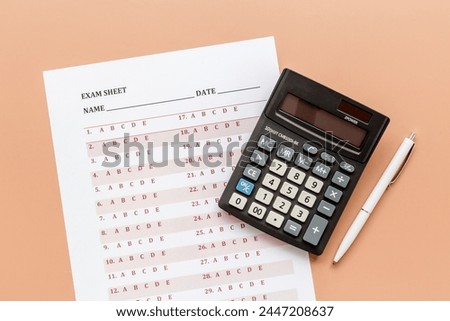 Answer exam sheet form on a table, top view. Education background.