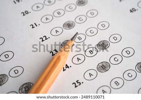 Answer sheets with pencil drawing fill to select choice education.