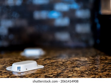 Ant Trap Poison Bate On A Granite Kitchen Countertop