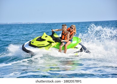 Antalya Turkey 20.10.2020: The Beautiful Couple Driving Jetski On Holiday.