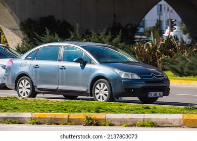 Antalya; Turkey – March 04 2022:  Silver  Citroën C4    Is  Driving   On The Street On A Warm  Autumn  Day 