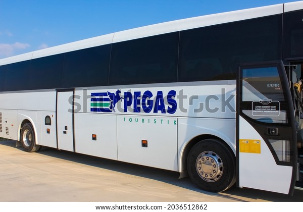 Antalya,\
Turkey - May 20, 2021: Pegas coach bus waiting for the tourists\
coming to Turkey to make transfer to the\
hotels.
