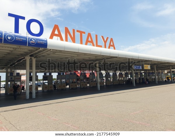 ANTALYA, TURKEY.\
May 20, 2022. Foreign tourists arriving to the Antalya\
international airport terminal for summer vacation at the Turkish\
resorts. Welcome to Antalya sign\
concept