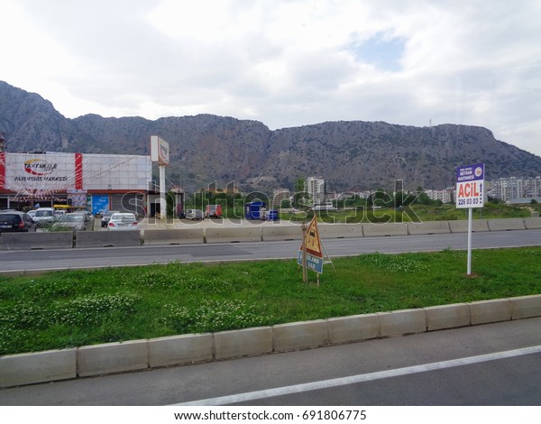 ANTALYA, TURKEY - MAY 9 2017: On the road through\
Antalya City. View to the roadside. Fifth-most populous city in\
Turkey. Asia Minor
