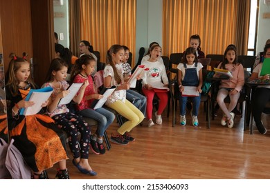 Antalya, Turkey - Nov 01, 2019: Kids Singing At Music Lesson In Primary School. Vocal Lessons For Childrens. People, School And Education Concept.