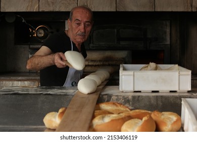 Antalya, Turkey - Nov 01, 2019: Senior Chef Baking Bread. Technique Of Baking Bread. Food Industry.