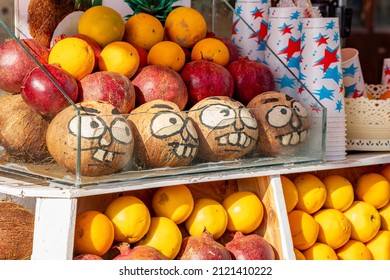 Antalya, Turkey - November 15, 2021: Funny Faces Painted On Coconuts On The Counter Of A Fruit Stand