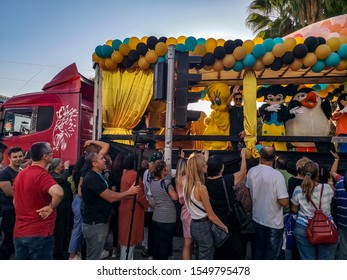 Antalya, Turkey - October 26, 2019: Parade Of The 56th Antalya Golden Orange Film Festival. People Meet A Car With Cartoon Characters On The Main Street Of Antalya