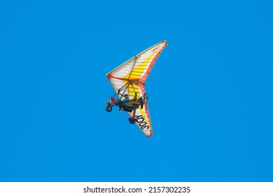 Antalya, Turkey-August 29, 2013: Motoparaglider flying in the blue sky.  Extreme flight on deltaplane. Microlight in fly by.