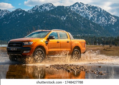 Antalya,Turkey-February 17, 2019: Ford Ranger pick-up truck is off roading in the mud of the river in the mountains of Antalya