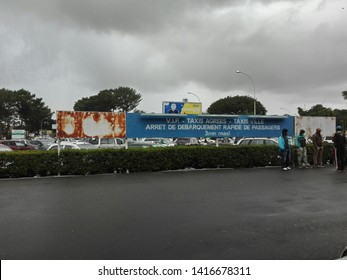 Antananarivo, Madagascar - June 03 2019 : View Of The Outdoor Pickup Of International Airport Of Antananarivo, Capital Of Madagascar, People Waiting, And Impatient Family 