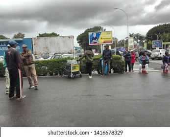 Antananarivo, Madagascar - June 03 2019 : View Of The Outdoor Pickup Of International Airport Of Antananarivo, Capital Of Madagascar, People Waiting, And Impatient Family 