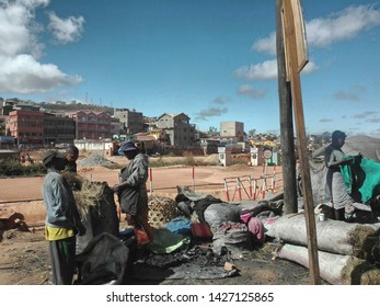 Antananarivo, Madagascar - June 10 2019:  People Selling And Buying Charcoal In The Suburb Of Antananarivo