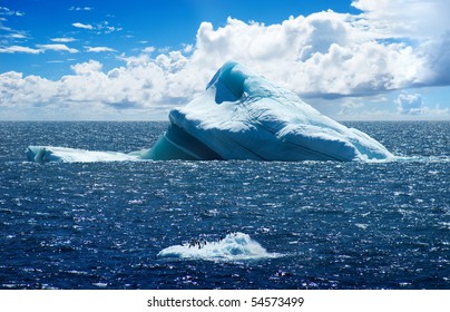 Antarctic ice island with penguins  in atlantic ocean - Shutterstock ID 54573499
