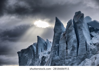 Antarctic Iceberg Navigation Concept - Sharp glacier pinnacles under dark stormy arctic sky