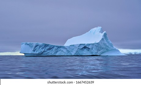 Antarctic Peninsula, Antarctica - January 2020: Massive Chunks Of Ice Melting Off Ice Shelves Creating Gigantic Icebergs 