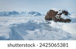 Antarctic snow mountain range winter landscape. Fly over the untouched wilderness of Antarctica. Breathtaking journey to frozen Arctic snowy land. Travel, explore icy wonders. Low angle drone flight