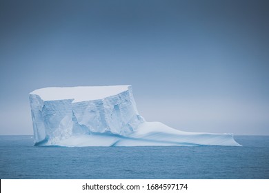 Antarctica Peninsula Landscape With People, Ships, Tender Boats, Penguins, Icebergs And Mountains