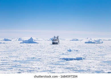 Antarctica Peninsula Landscape With People, Ships, Tender Boats, Penguins, Icebergs And Mountains