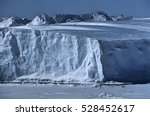 Antarctica, Weddell Sea, Riiser Larsen Ice Shelf, Iceberg with Emperor Penguins