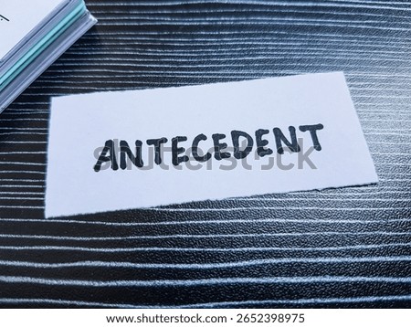 Antecedent writting on table background.