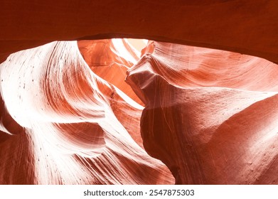 Antelope Canyon. A breathtaking slot canyon in Arizona, Antelope Canyon features winding, narrow passages with stunning, swirling sandstone formations. Known for its ethereal light beams and vibrant - Powered by Shutterstock