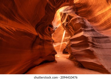 Antelope Canyon is a slot canyon in the American Southwest. It is on Navajo land east of Page, Arizona. USA. Amazing light beam.