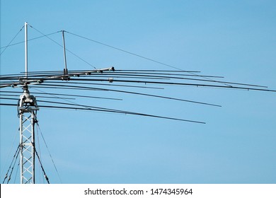 Antenna mast against blue sky background