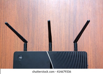 antenna Wireless Router wooden background.