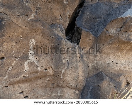 An anthropomorphic petroglyph - simpler and perhaps incomplete, is among the 4000 plus images at La Cieneguilla near Santa Fe, NM 2026