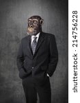 Anthropomorphous chimpanzee dressed and standing like a businessman