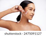 Anti aging, woman and rose quartz as face roller for beauty, detox and dermatology on white background. Female person, cosmetic tool and skincare for results in studio backdrop for wellness or glow