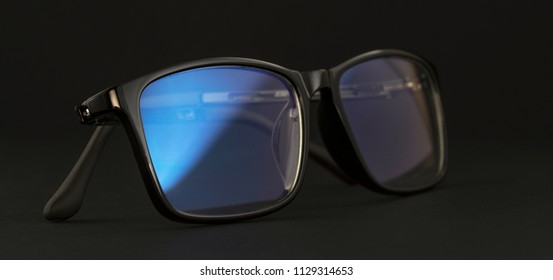 Anti Blue Light Computer Glasses On The Black Background.