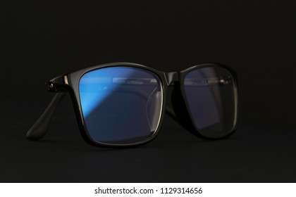 Anti Blue Light Computer Glasses On The Black Background.