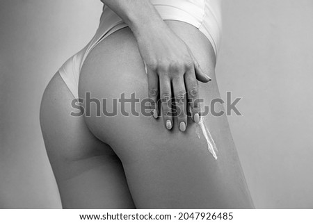 Similar – Anonymous woman applying sunscreen by the poolside