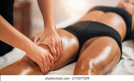 Anti cellulite female thigh massage at a beauty spa salon. Body care concept.