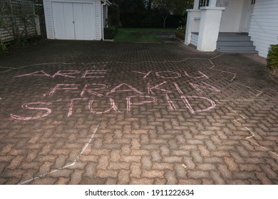 Anti Fracking Protest Message In Chalk On Pavement.