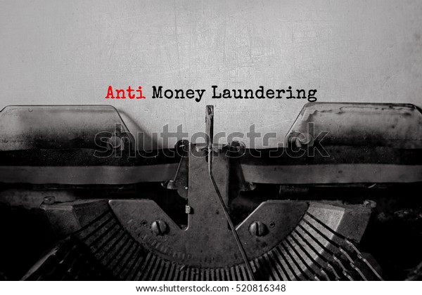 anti\
money laundering typed words on a vintage\
typewriter