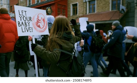 Anti murder demonstration city street. Stop abortion protest. Girl hold let baby live placard. Kill ban prohibition. Pro life banner. No roe v wade law. Angry women crowd Lot female people fight right