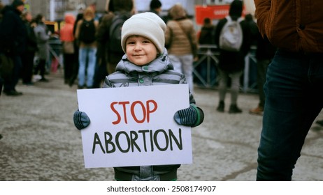 Anti murder demonstration city street. Stop abortion protest. Cute little boy hold let baby live placard. Kill ban prohibition. Pro life banner. No roe v wade law. Lot people crowd fight rights.