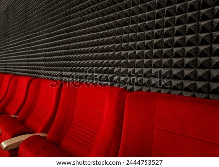 anti noise materials for door fillings and recording studios. foam with an articulated pyramid pattern. padding shattering sound waves in the apartment, theatre, red, cinema, suede, upholstery