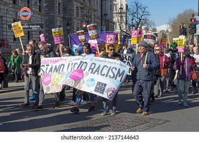 Anti Racism Protest On The Streets Of London. A Group Of People Holding A Stand Up To Racism Banner. London - 19th March 2022