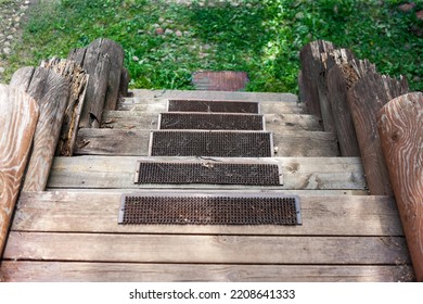 Anti Slippery Mats On Rotten Wood Steps Of A House Leading Down, Outdoor Shot, No People 